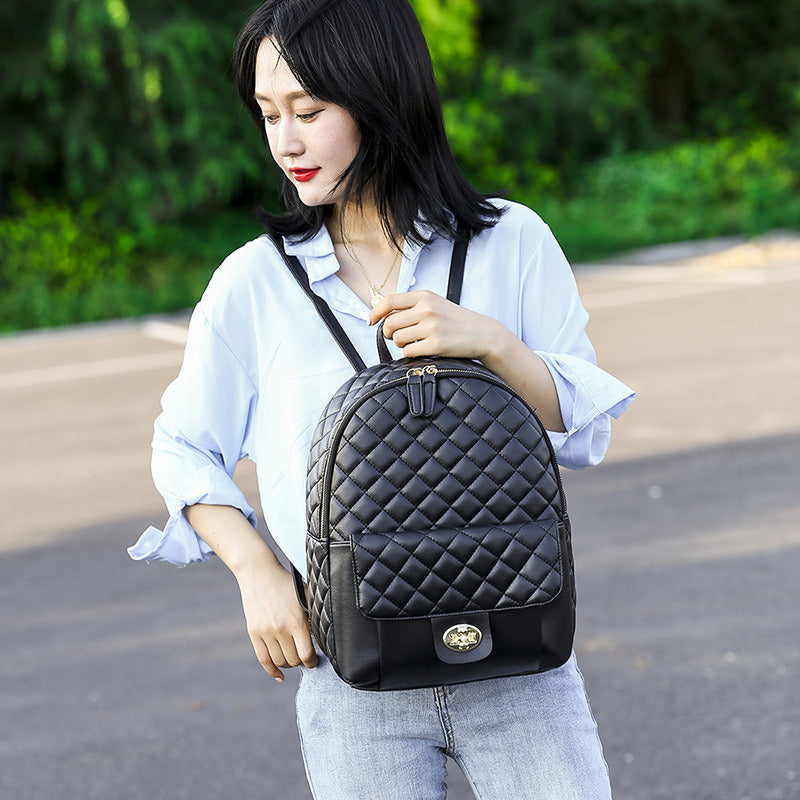 A Doba black leather backpack for men women school college bookbag for student on a white background.