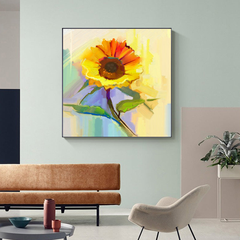 A colorful Modern canvas wall art famous sunflower flower decoration hung above a grey sofa, in a modern living room with grey cabinetry and subtle décor.