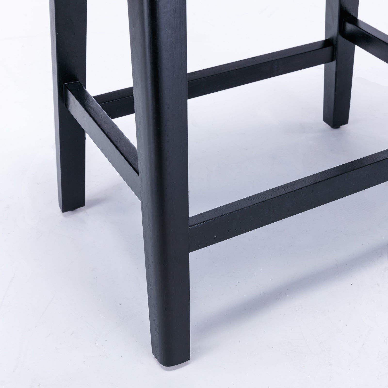 Two A&A Furniture, Counter Height 25" Stools for Kitchen Counter Backless Faux Leather Stools Farmhouse Island Chairs (25 Inch, Gray, Set of 2), SW1838GY in a room with a wooden table.