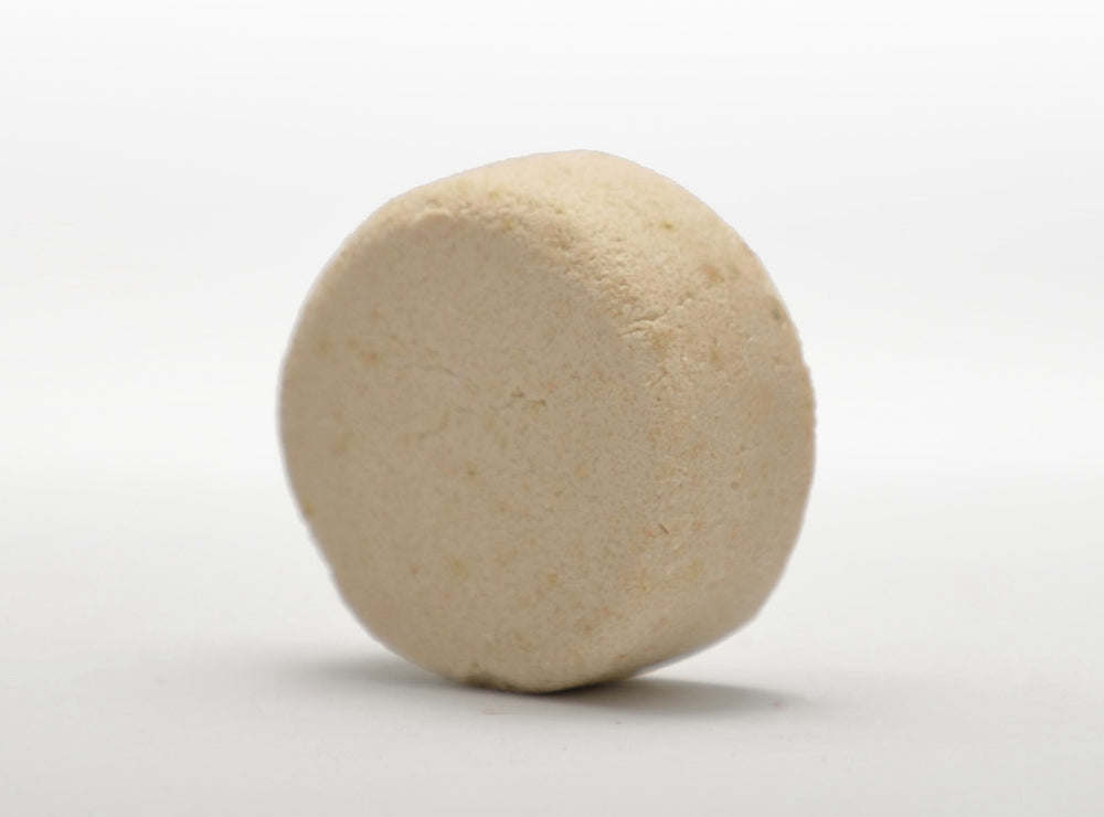 A purple handmade Natural Shampoo Bar with sulfate-free formula for promoting hair growth, showcased on a pristine white background.