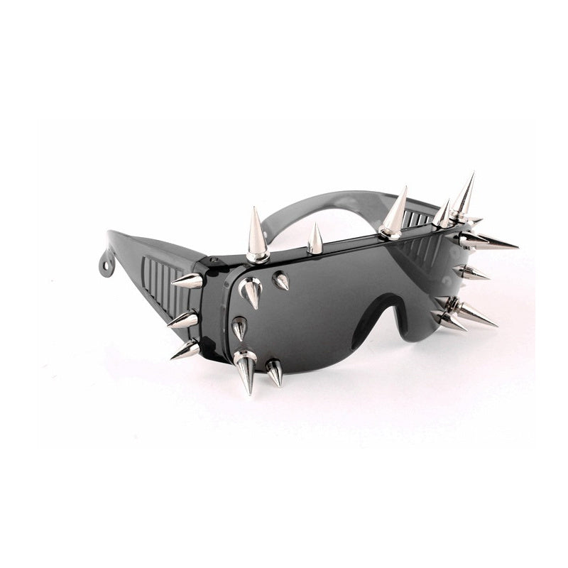 A pair of black Fashion Windproof Sunglasses Women New Oversized Mirror Men Shades Glasses Luxury Brand Metal Rivet Futuristic Female Eyewear NX with numerous silver spikes on the frames and arms, featuring UV400 protection, placed against a white background.