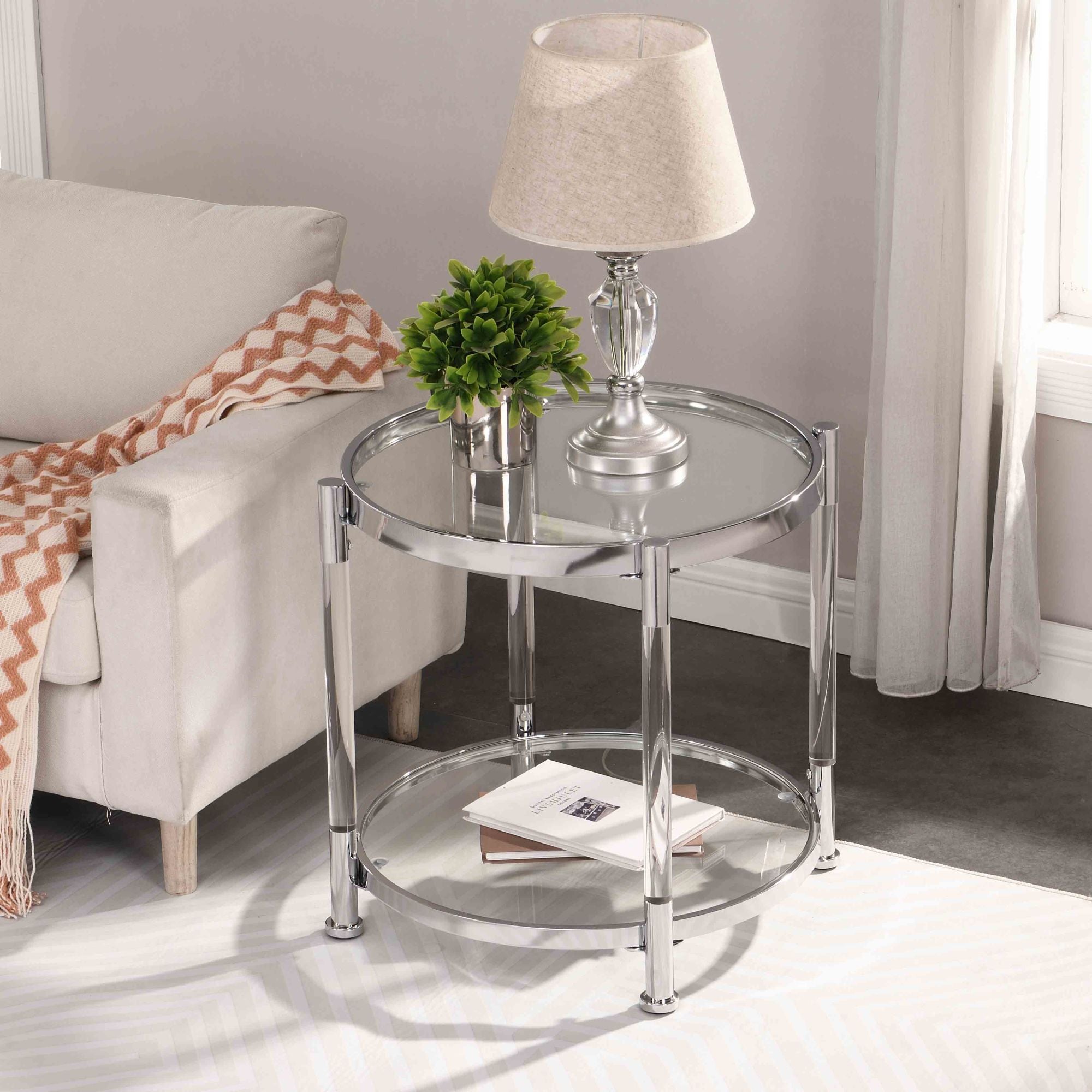 A W82153571 Contemporary Acrylic End Table with chrome legs and a tempered glass top, featuring a lamp on top.