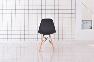 The Set of 4 Modern Style Dining Chairs are mid-century modern side chairs with a black plastic shell lounge design, wooden walnut legs, and metal supports, perfect for your kitchen, dining room, bedroom, or living room.