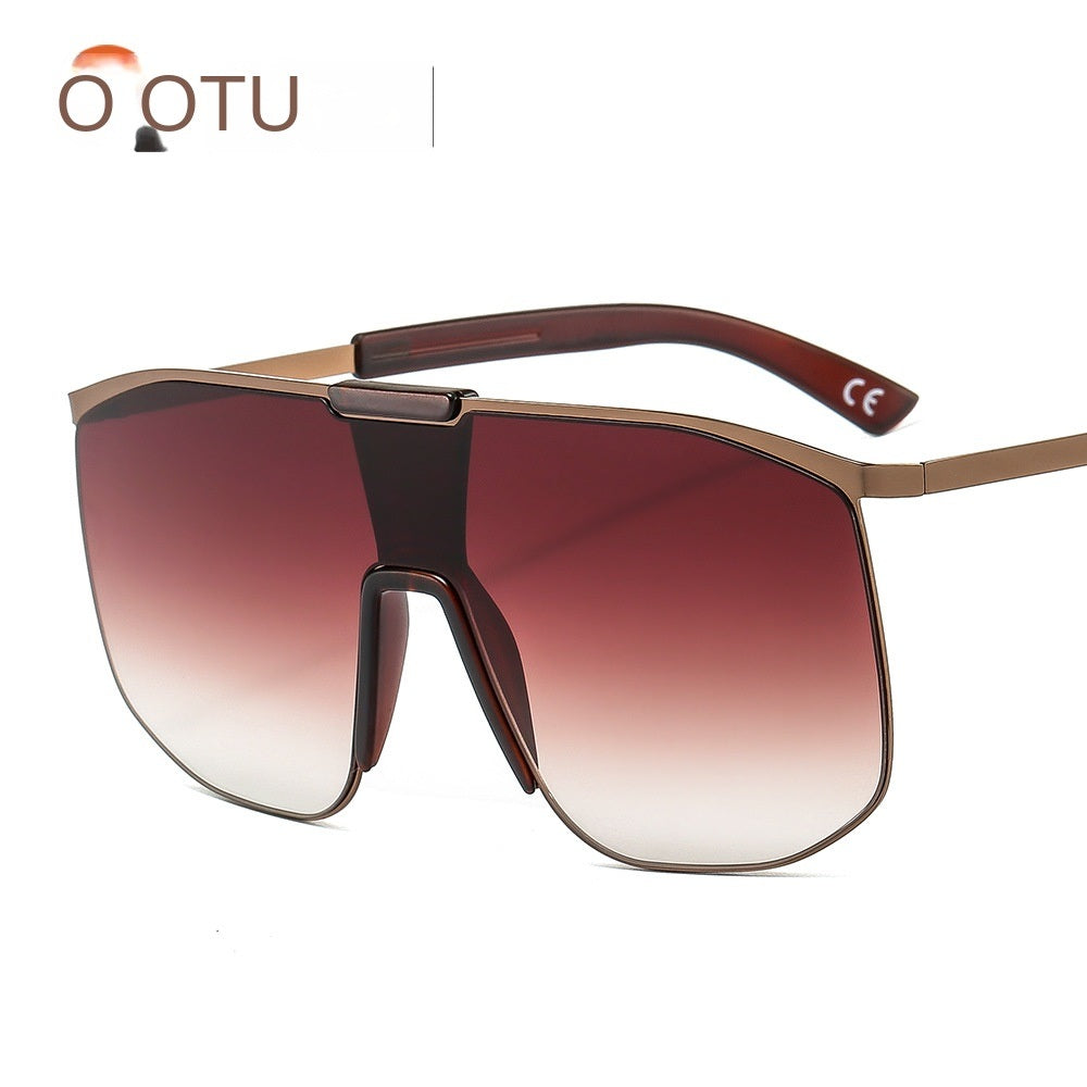 Fashionable and modern color metal one-piece sunglasses for men and women large frame integrated sunglasses with UV400 gradient tint lenses and thin temples, isolated on a white background.