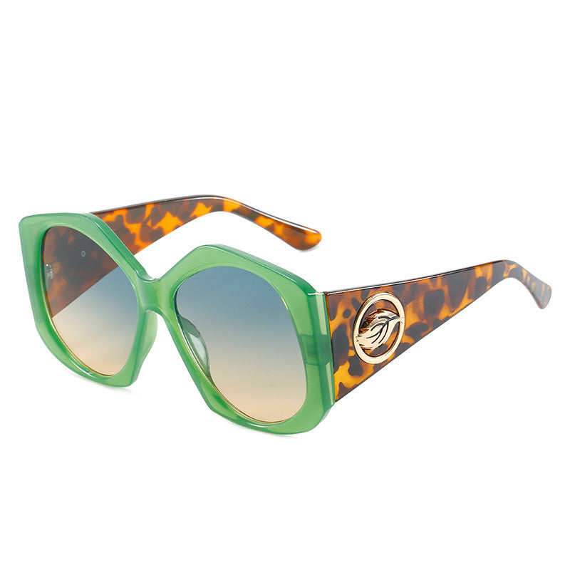 A pair of Fashio Rhombus Sunglasses Women Big Frame Sunglass Vintage Sun Glass Men Luxury Brand Design Eyewear UV400 Gradient Shades with green frames and flame-patterned arms resting on a white background.