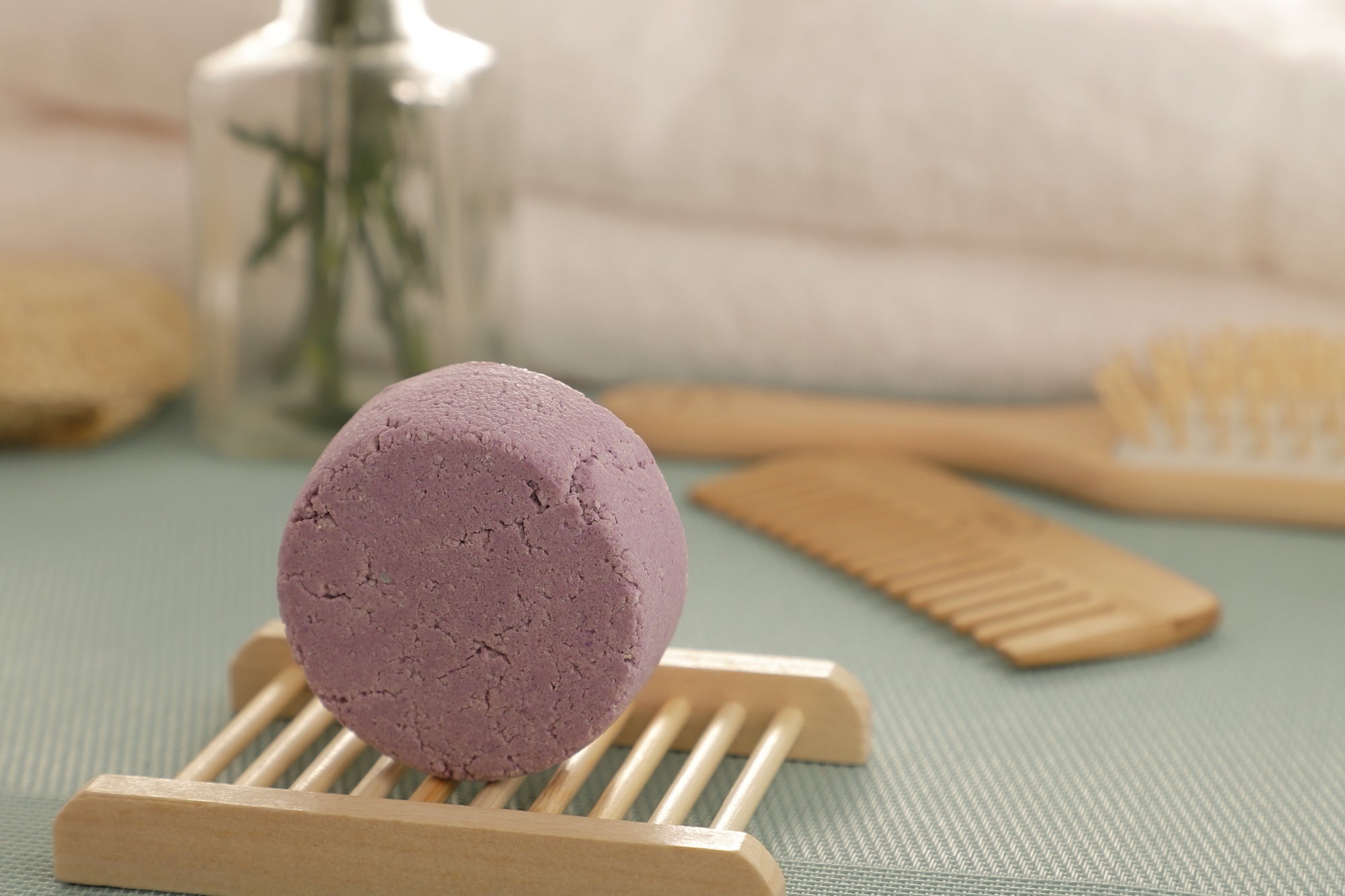 A purple handmade Natural Shampoo Bar with sulfate-free formula for promoting hair growth, showcased on a pristine white background.