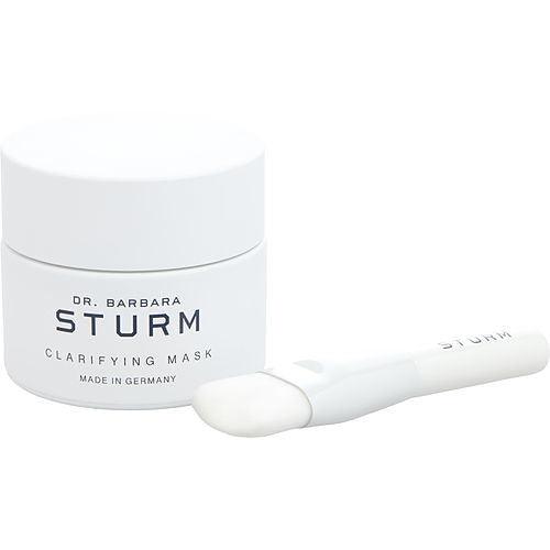 Jar of Dr. Barbara Sturm by Dr. Barbara Sturm Clarifying Mask, 50ml/1.7oz, with an application brush beside it, on a white background.