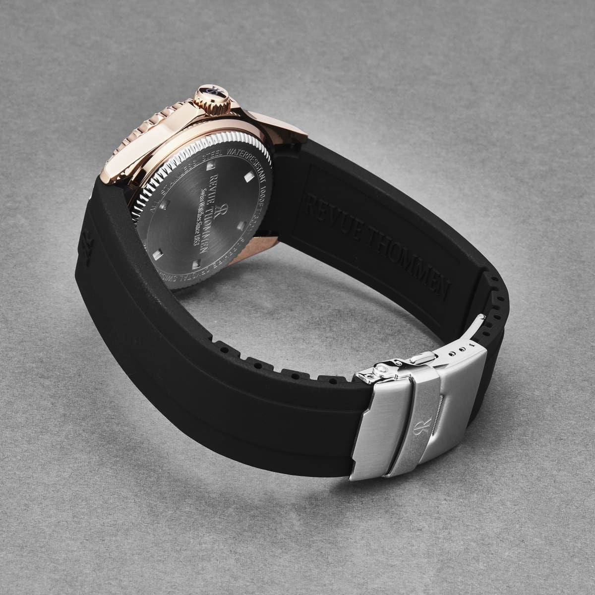 A Revue Thommen Men's 'Diver' Blue Dial Black Rubber Strap Swiss Automatic Watch 17571.2865 with a blue dial and black strap.