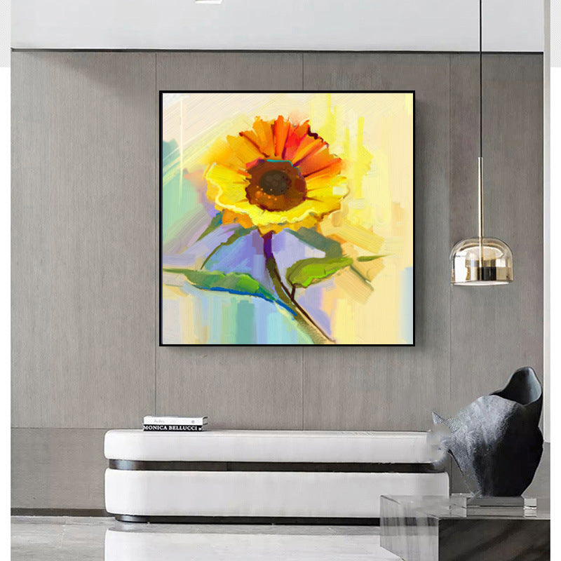 A colorful Modern canvas wall art famous sunflower flower decoration hung above a grey sofa, in a modern living room with grey cabinetry and subtle décor.