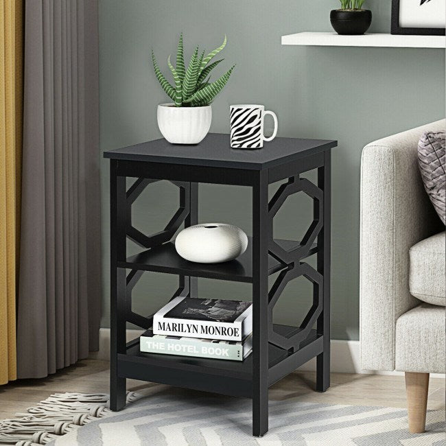 A black Simple And Fashion 3-tier Sofa Side End Accent Table Nightstand with a storage compartment filled with books and magazines on it.