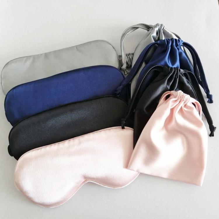 A Soft Eyes Sleep Mask In A Pouch Set on a white surface.