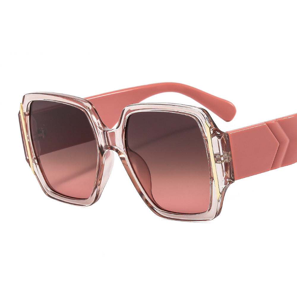 A pair of oversized, pink square-framed women's sunglasses Fashion Women Square Sunglasses Shades UV400 with thick arms, lying horizontally on a white background.