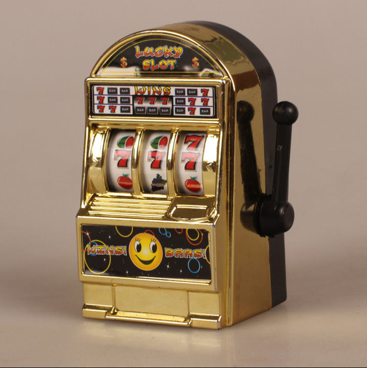 Two Cross-Border Children's Handheld Lottery Machine Toy Learning You Winning Game Machines featuring reels with details such as fruit and smiley face symbols, set against a plain white background.