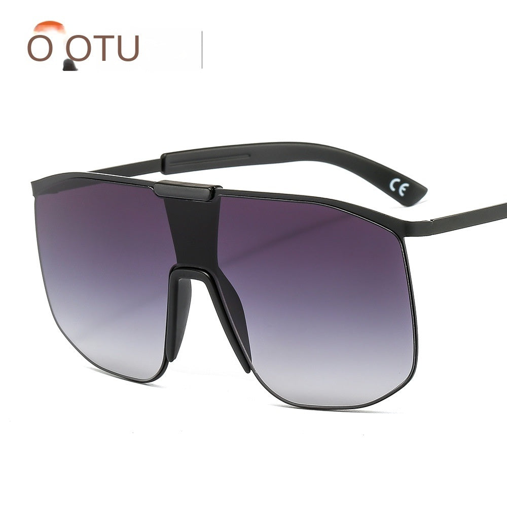 Fashionable and modern color metal one-piece sunglasses for men and women large frame integrated sunglasses with UV400 gradient tint lenses and thin temples, isolated on a white background.