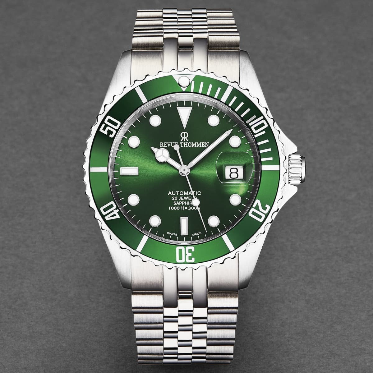 A Revue Thommen Men's 'Diver' Black Dial Stainless Steel Bracelet Automatic Watch 17571.2234 with a green dial.