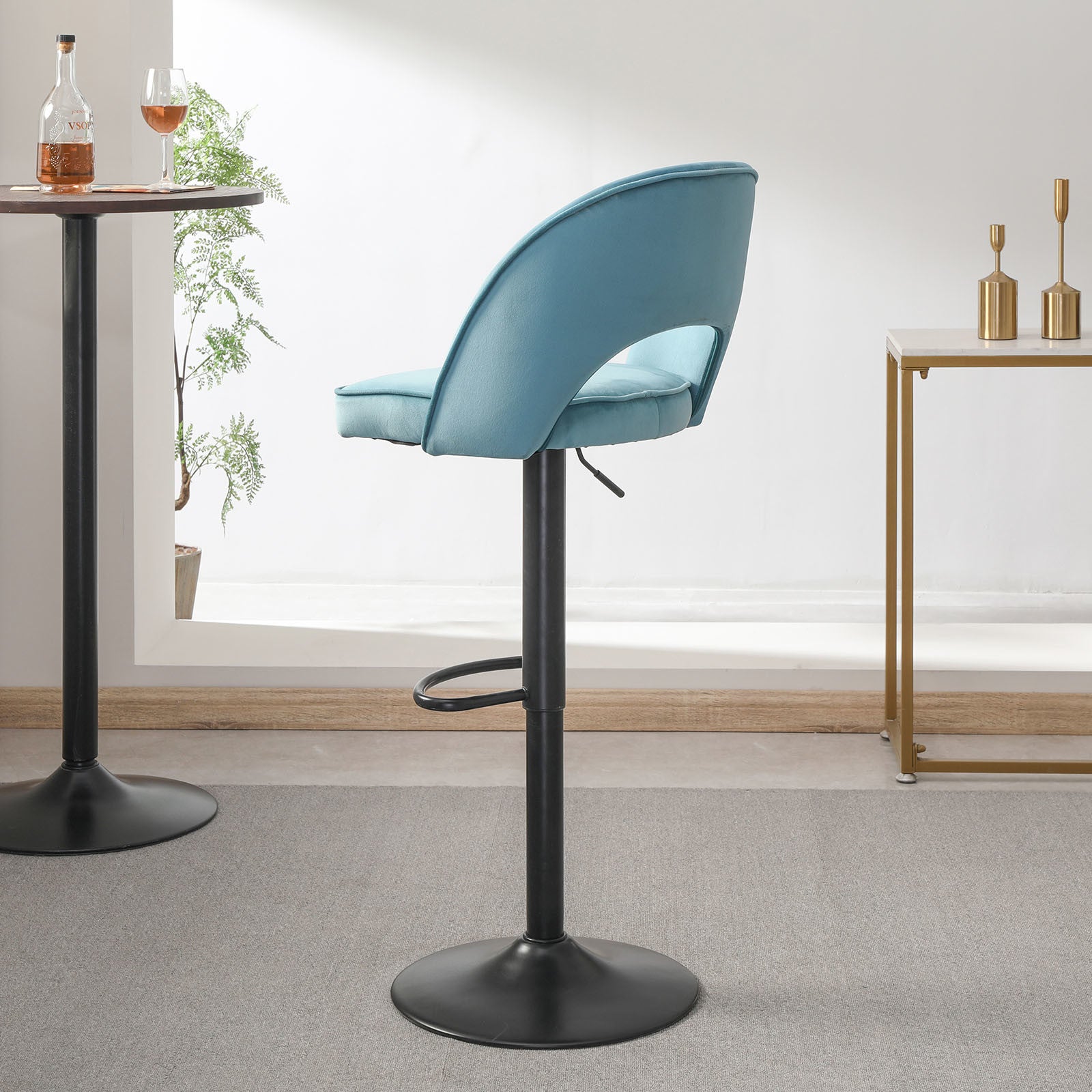 Modern Bar Stool with a curved backrest and an adjustable height black pedestal base, isolated on a white background.