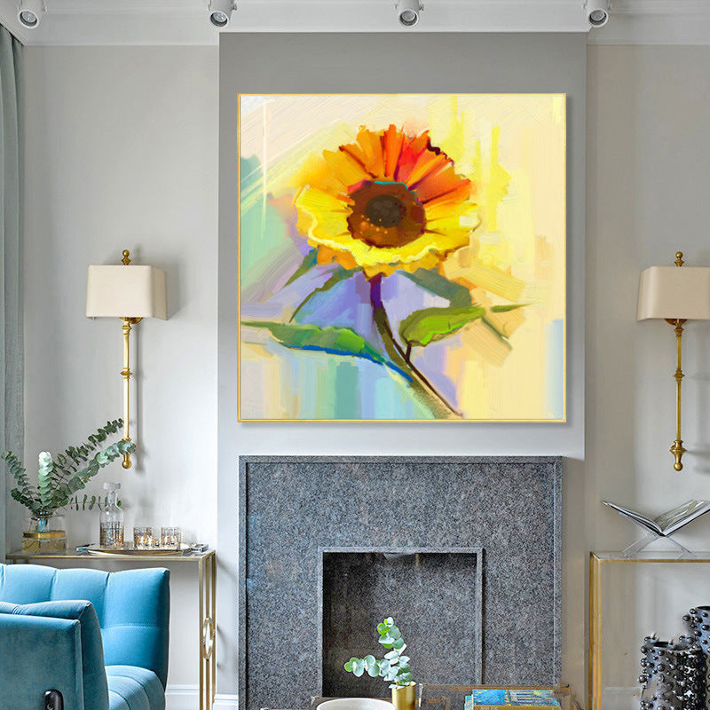 A colorful Modern canvas wall art famous sunflower flower decoration hung above a grey sofa, in a modern living room with grey cabinetry and subtle décor.