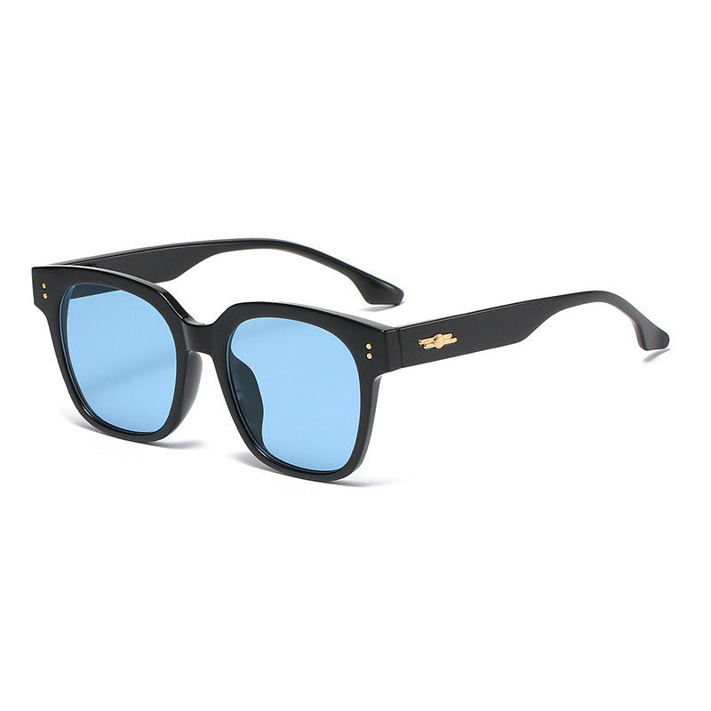 A pair of Fashion Square Sunglasses Women Rivets Glasses Retro Leopard Sunglass Men Luxury Designer Eyewear UV400 Sun Glass Clear Shades with blue UV blocking lenses and gold detailing on the temples, ideal for outdoor sports activities.
