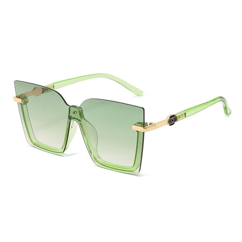 The Sunglasses Ocean Slices Multicolor Personality Trend Sunglasses for Men and Women feature a black oversized square design with gradient lenses, highlighted by thin gold accents on the temples and a small decorative logo near the hinges. These polarized sunglasses offer UV400 protection, making them both stylish and practical for fashion wear.