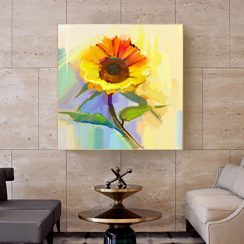 A colorful Modern canvas wall art famous sunflower flower decoration hung above a grey sofa, in a modern living room with grey cabinetry and subtle décor.