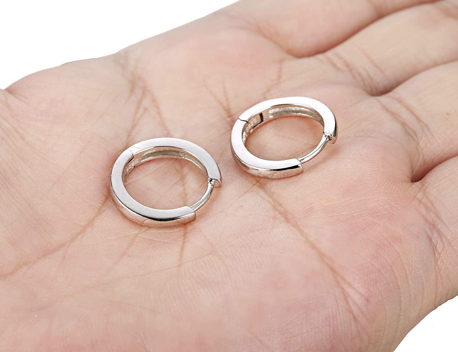 A pair of 925 Sterling Silver Hoop Earrings for Women Men Ear Cuff Small Huggie Earrings Cartilage Piercing Earrings 13mm with a minimalist design, each featuring a small diamond accent at the top.