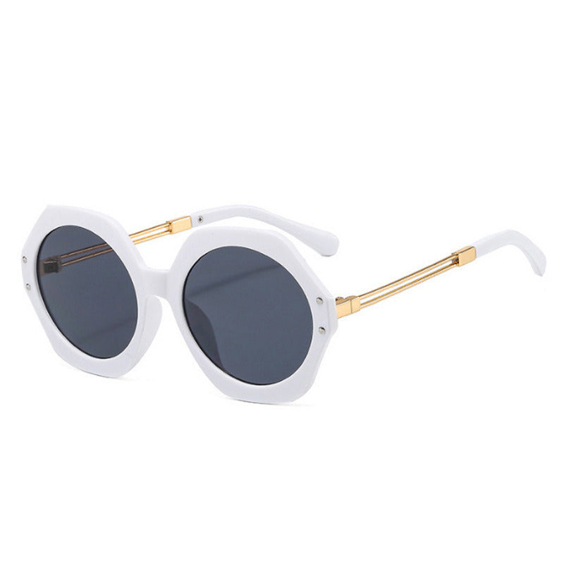 A pair of black, oversized hexagonal irregular sunglasses men's foreign trade geometric polygon sunglasses women's sunglasses with gold metal arms on a white background, featuring UV400 protection.