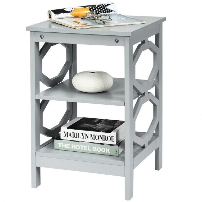 A black Simple And Fashion 3-tier Sofa Side End Accent Table Nightstand with a storage compartment filled with books and magazines on it.