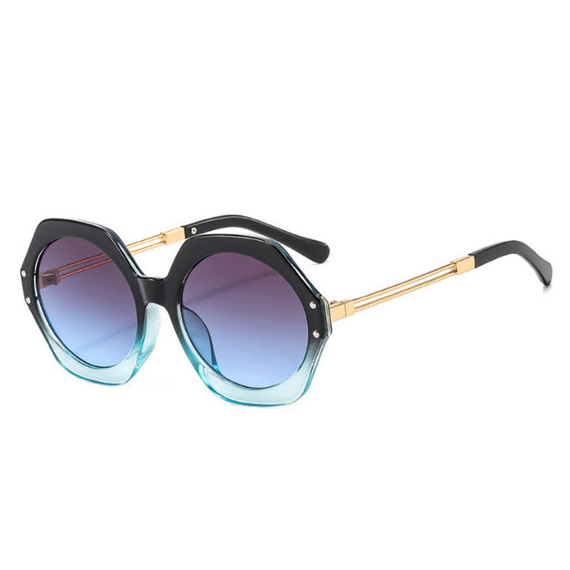 A pair of black, oversized hexagonal irregular sunglasses men's foreign trade geometric polygon sunglasses women's sunglasses with gold metal arms on a white background, featuring UV400 protection.