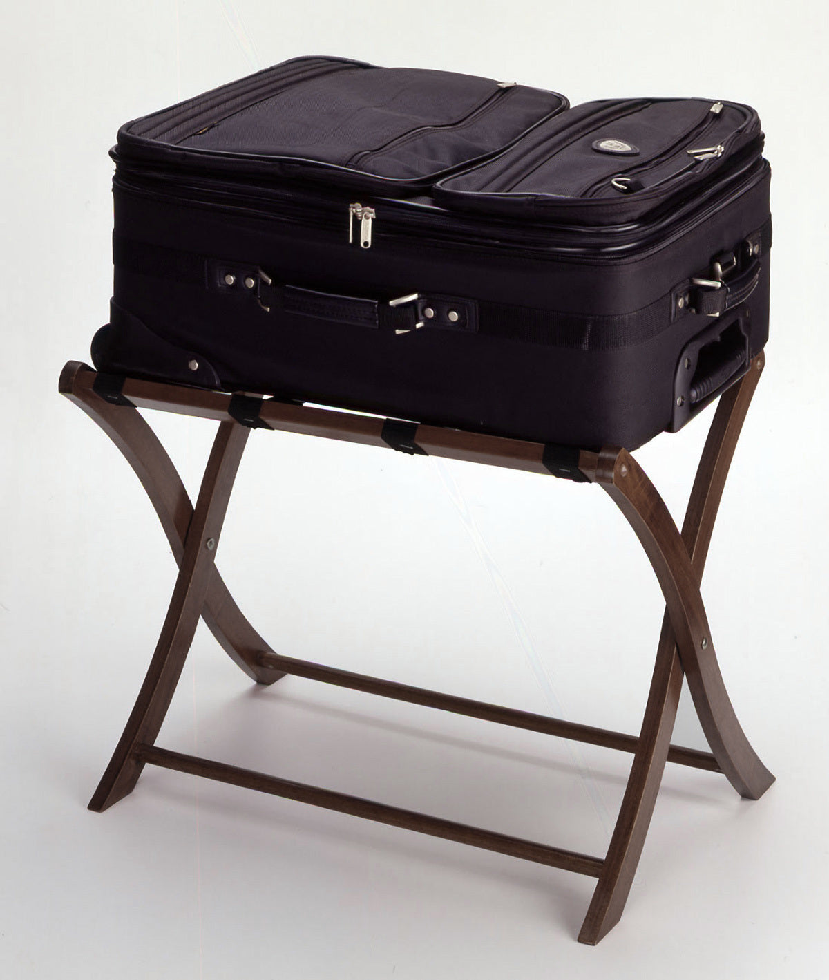 A Scarlett Luggage Rack Walnut with black straps on it.