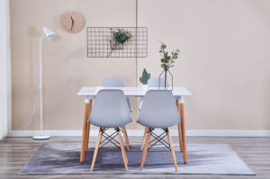 The Set of 4 Modern Style Dining Chairs are mid-century modern side chairs with a black plastic shell lounge design, wooden walnut legs, and metal supports, perfect for your kitchen, dining room, bedroom, or living room.