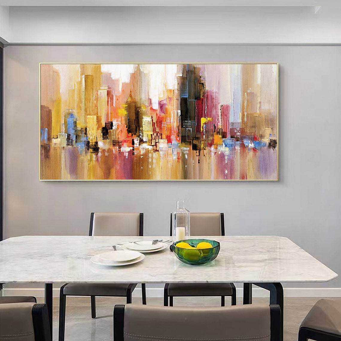 A modern dining room featuring a large Hand Painted Urban Architecture Landscape Abstract Oil Painting Canvas Nordic Poster Wall Art Picture Living Room Home Decor above a white marble table set for two.