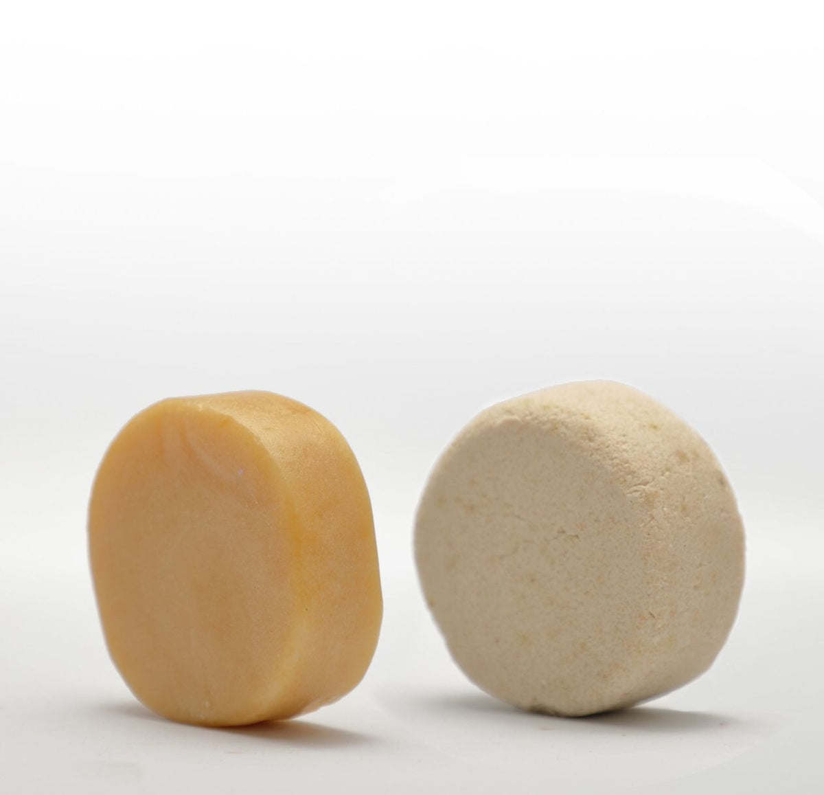 Two Shampoo Bar & Conditioner Bar Bundles on a white surface.