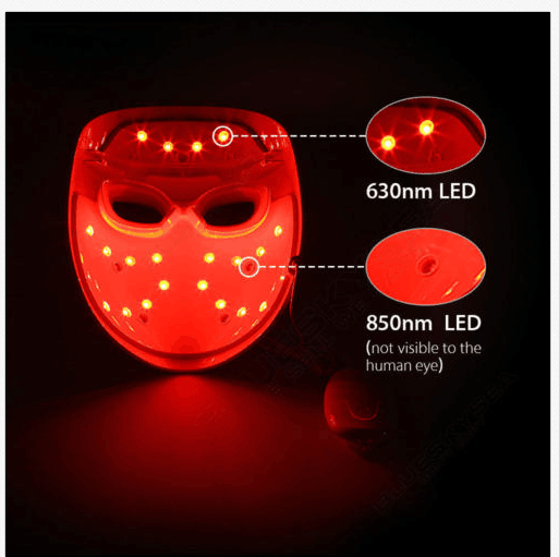 A Made in KOREA LED face mask light therapy led mask red light IR photon skin rejuvenation on a table next to a box for LED photon light therapy.