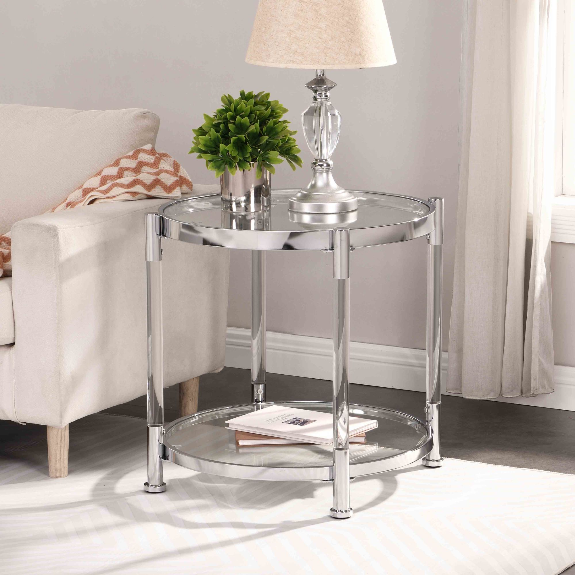 A W82153571 Contemporary Acrylic End Table with chrome legs and a tempered glass top, featuring a lamp on top.