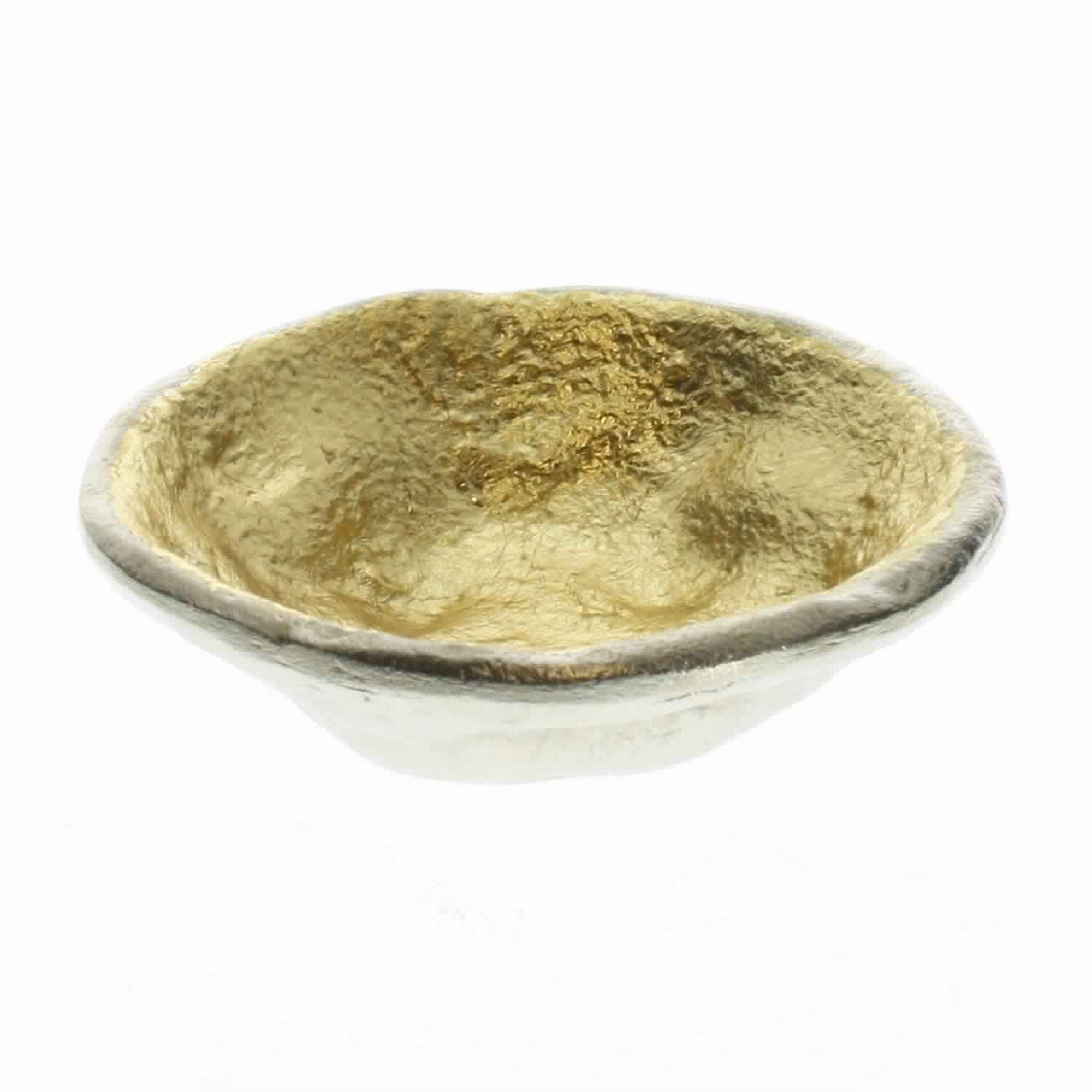 A small aluminum bowl with a shimmering gold leaf interior and a smooth white exterior, isolated on a white background from DunaWest.