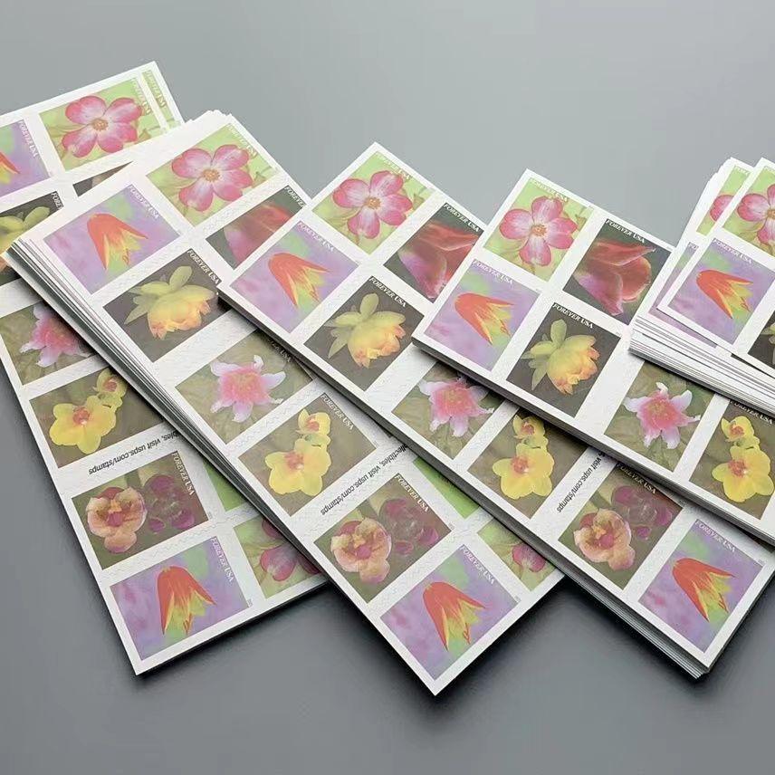 A booklet of "Garden Beauty 2021" USPS First-Class Forever stamps, issued in 2021, featuring various colorful flowers.
