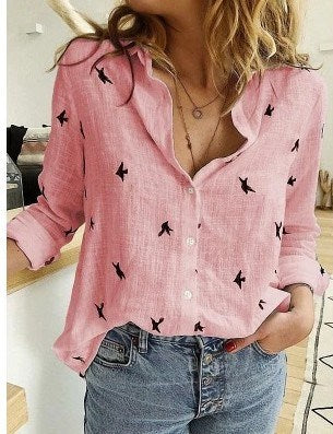 Woman wearing a pink Casual Long Sleeve Birds Print Loose Shirt tucked into blue jeans.