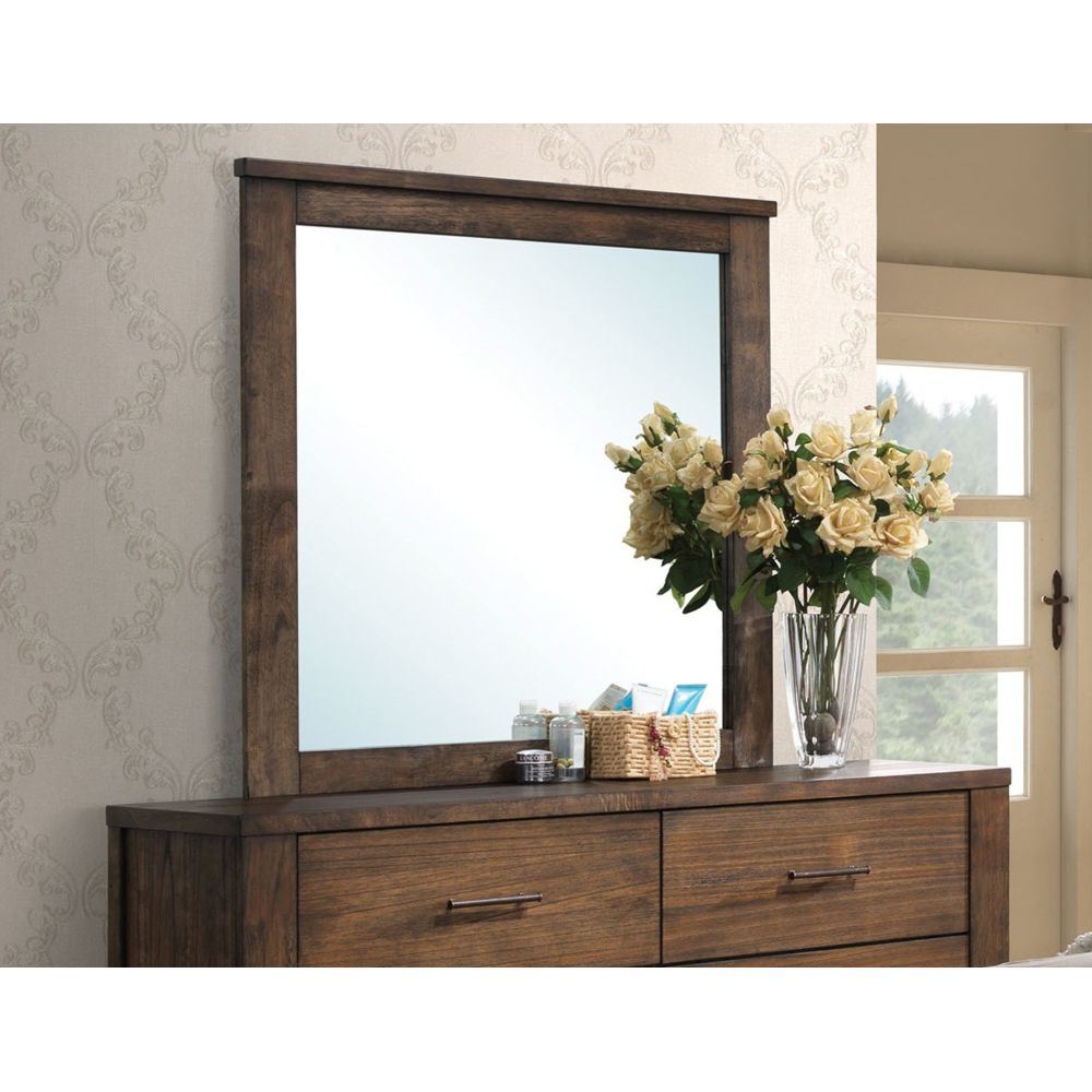 A stylish wooden dresser with a Merrilee Mirror in Oak YJ on top.