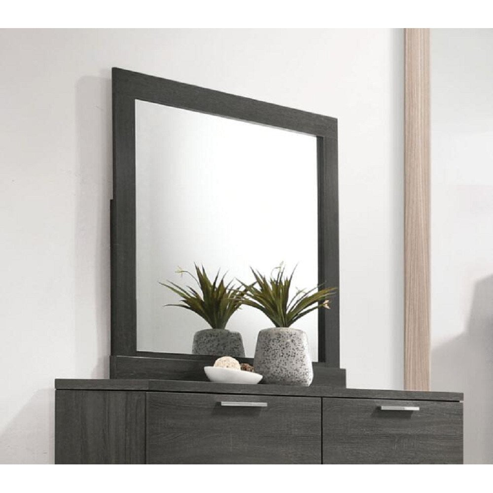 A transitional grey dresser with a Lantha Mirror in Gray Oak YJ on top.