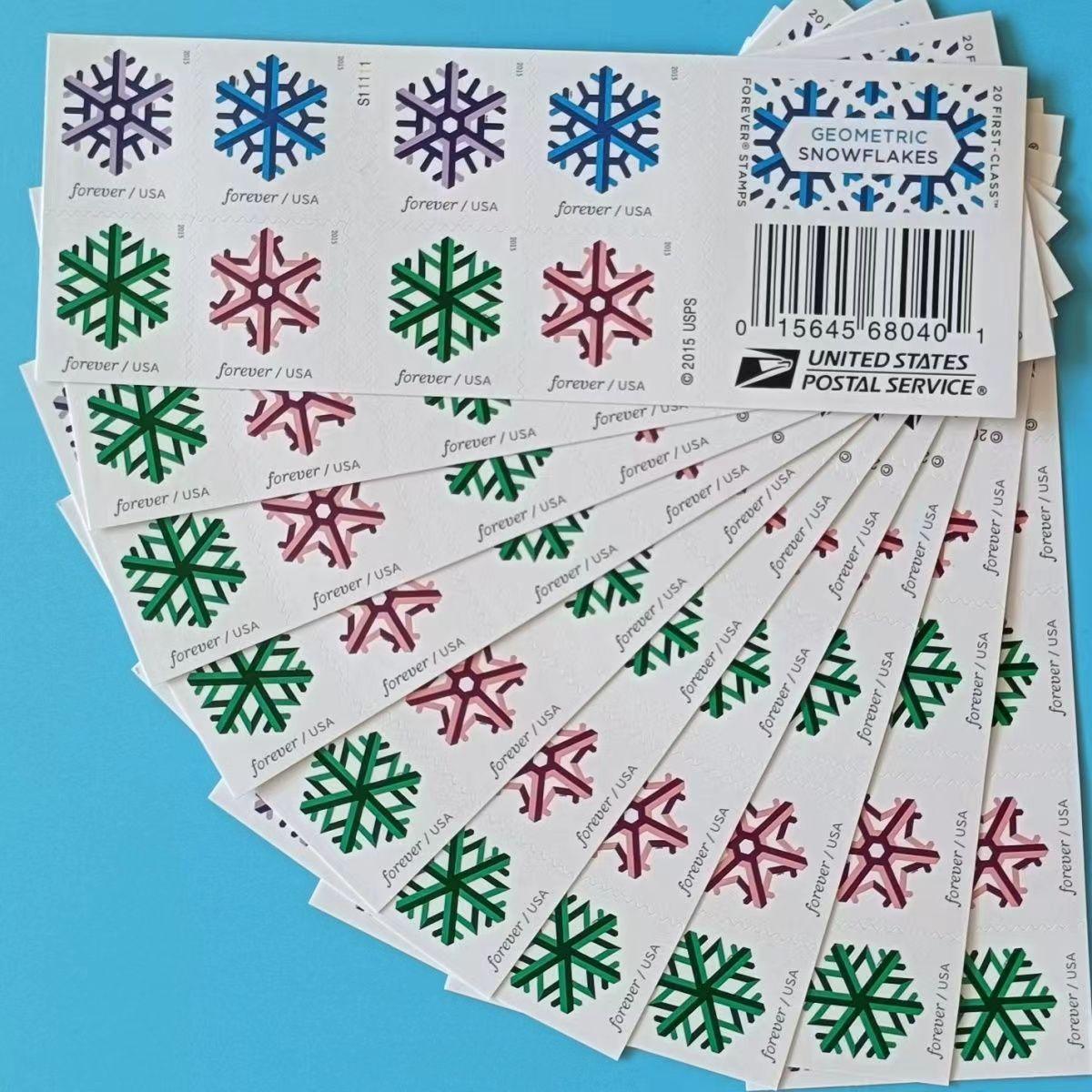A sheet of Geometric Snowflakes 2015 postage stamps with colorful geometric snowflake designs against a light blue background.