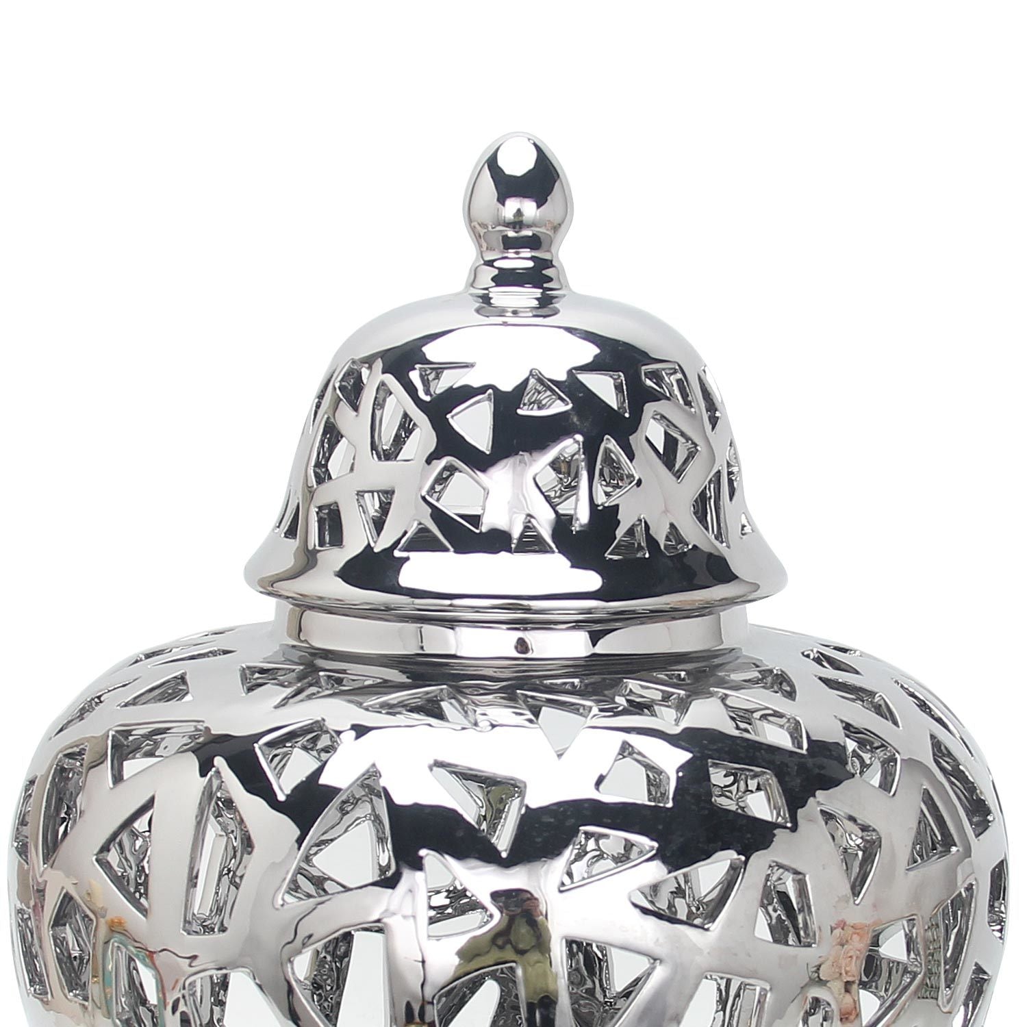 The Silver Ceramic Ginger Jar Vase with Decorative Design is a reflective silver ceramic vase that comes with a fitted decorative lid and features an intricate cut-out pattern. This exquisite piece of home decor adds elegance to any space.