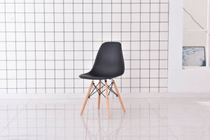 The Set of 4 Modern Style Dining Chairs are mid-century modern side chairs with a black plastic shell lounge design, wooden walnut legs, and metal supports, perfect for your kitchen, dining room, bedroom, or living room.