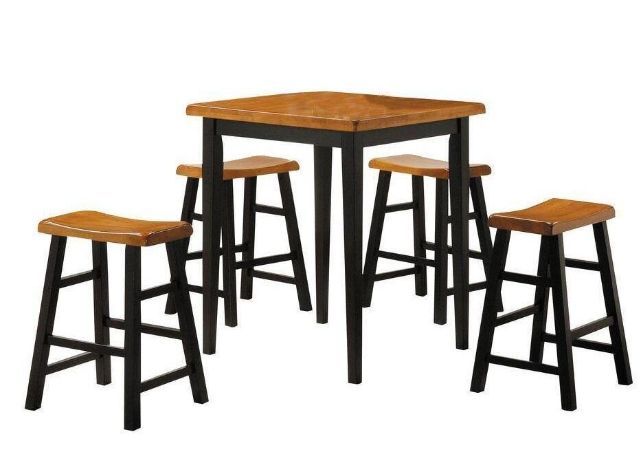This Gaucho Counter Height Set (5Pc Pk) in Oak & Black features a space saving design, with four stools and a table. The set is made with a solid wooden top for durability and aesthetics.