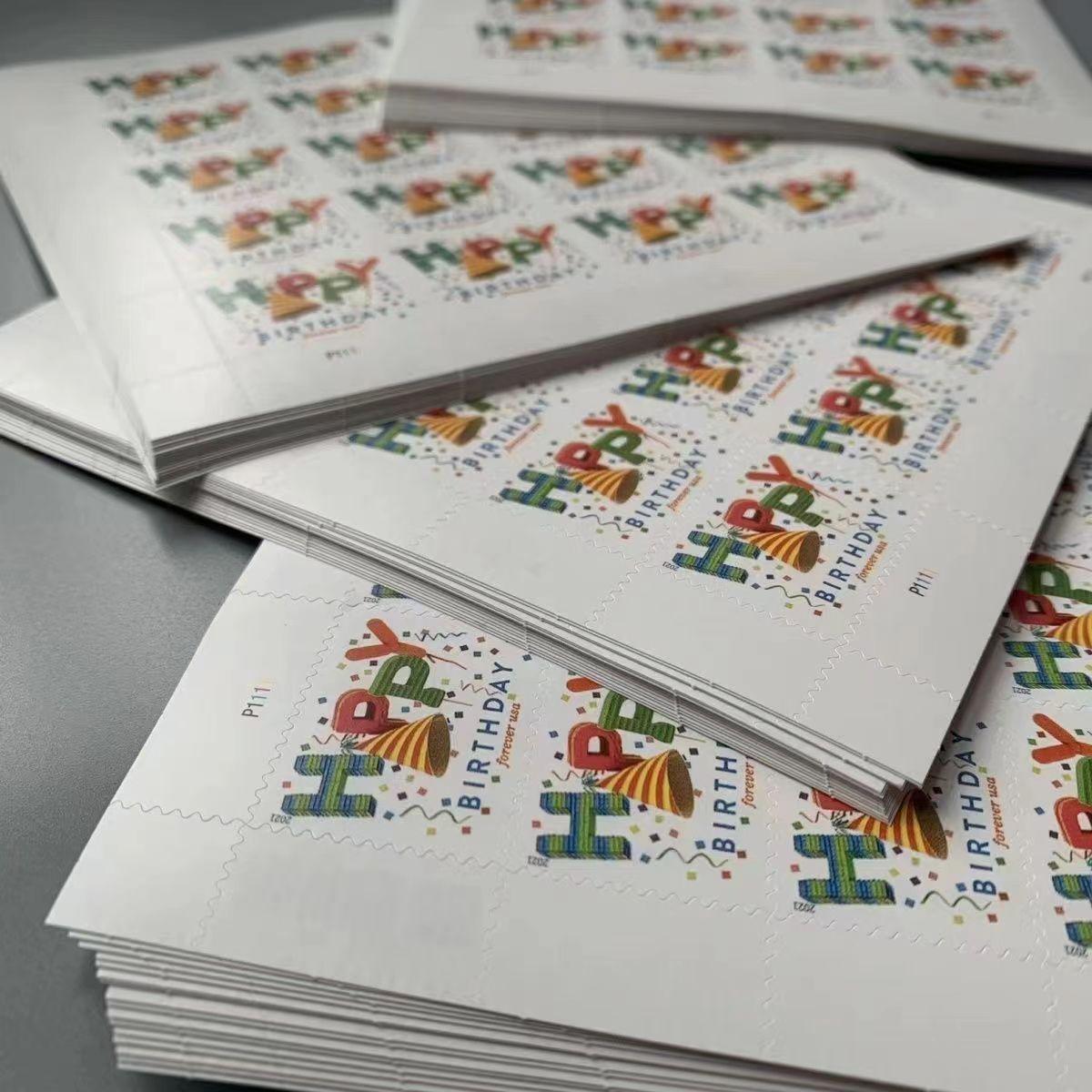 A stack of Happy Birthday 2021 - 5 Sheets / 100 Pcs featuring a colorful "happy holidays" design with festive graphical elements from 2021.