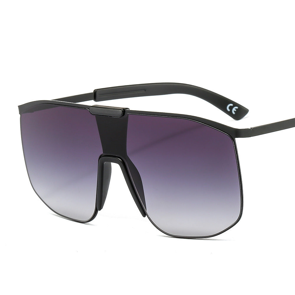 Fashionable and modern color metal one-piece sunglasses for men and women large frame integrated sunglasses with UV400 gradient tint lenses and thin temples, isolated on a white background.