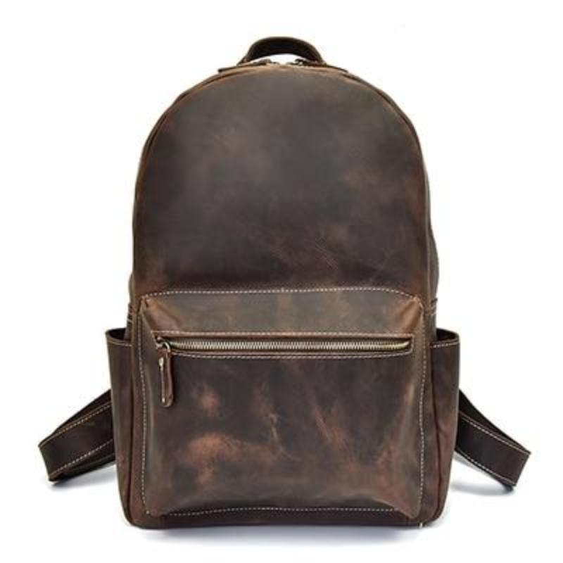 A brown leather Calder Backpack by Doba on a white background.