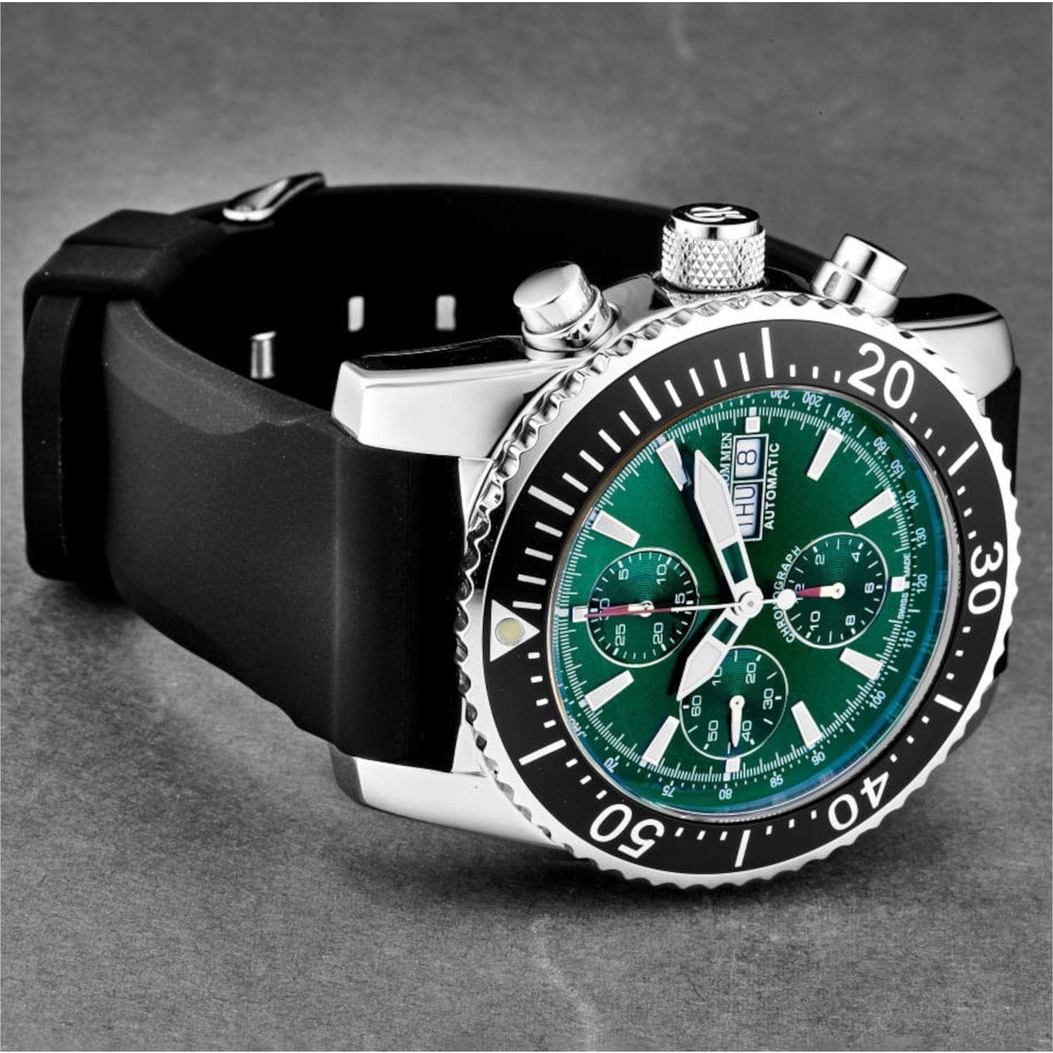 The Revue Thommen 17030.6522 Men's 'Air Speed' Green Dial Rubber Strap Chronograph Automatic Watch features a green dial and is set against a white background.