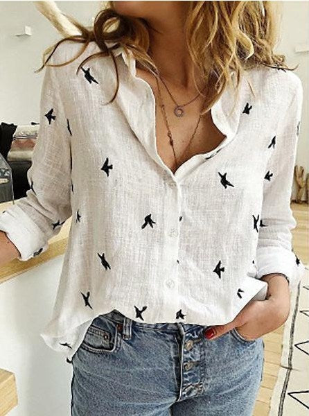 Woman wearing a pink Casual Long Sleeve Birds Print Loose Shirt tucked into blue jeans.