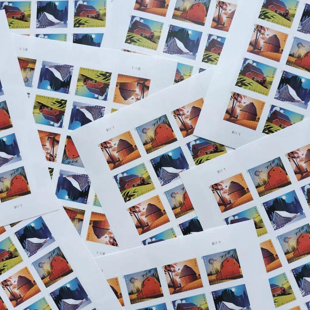 A collection of five Barn Postcard 2021 - 5 Sheets / 100 Pcs fanned out on a white surface, featuring various colorful wildlife images from 2021.