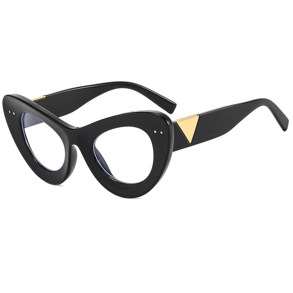 A pair of Retro Cat Eye sunglasses with clear lenses and gold triangular accents on the temples, offering stylish UV400 protection.